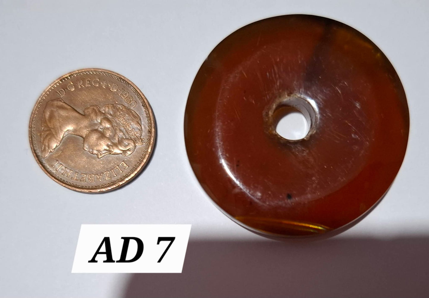 Red Amber Disc/ Doughnut carving, Sphere holder, 6.10g, Fossil (Ref: AD7)