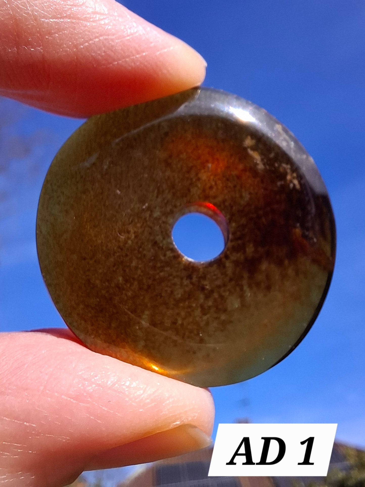 Red Amber Disc/Doughnut carving/sphere holder, 4.13g, Fossil (Ref: AD1)