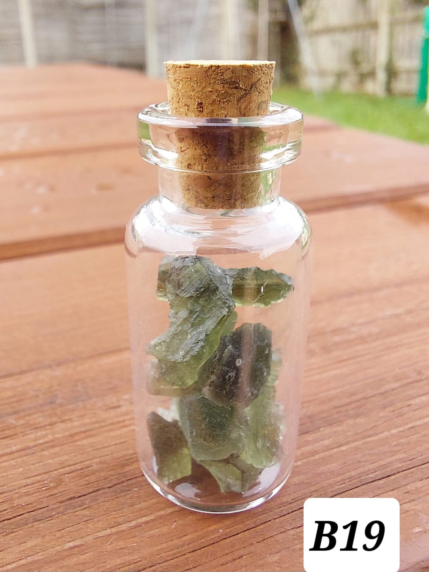 Moldavite chips (2.50g) in 3ml glass Bottle, Tektite (Ref: B19)