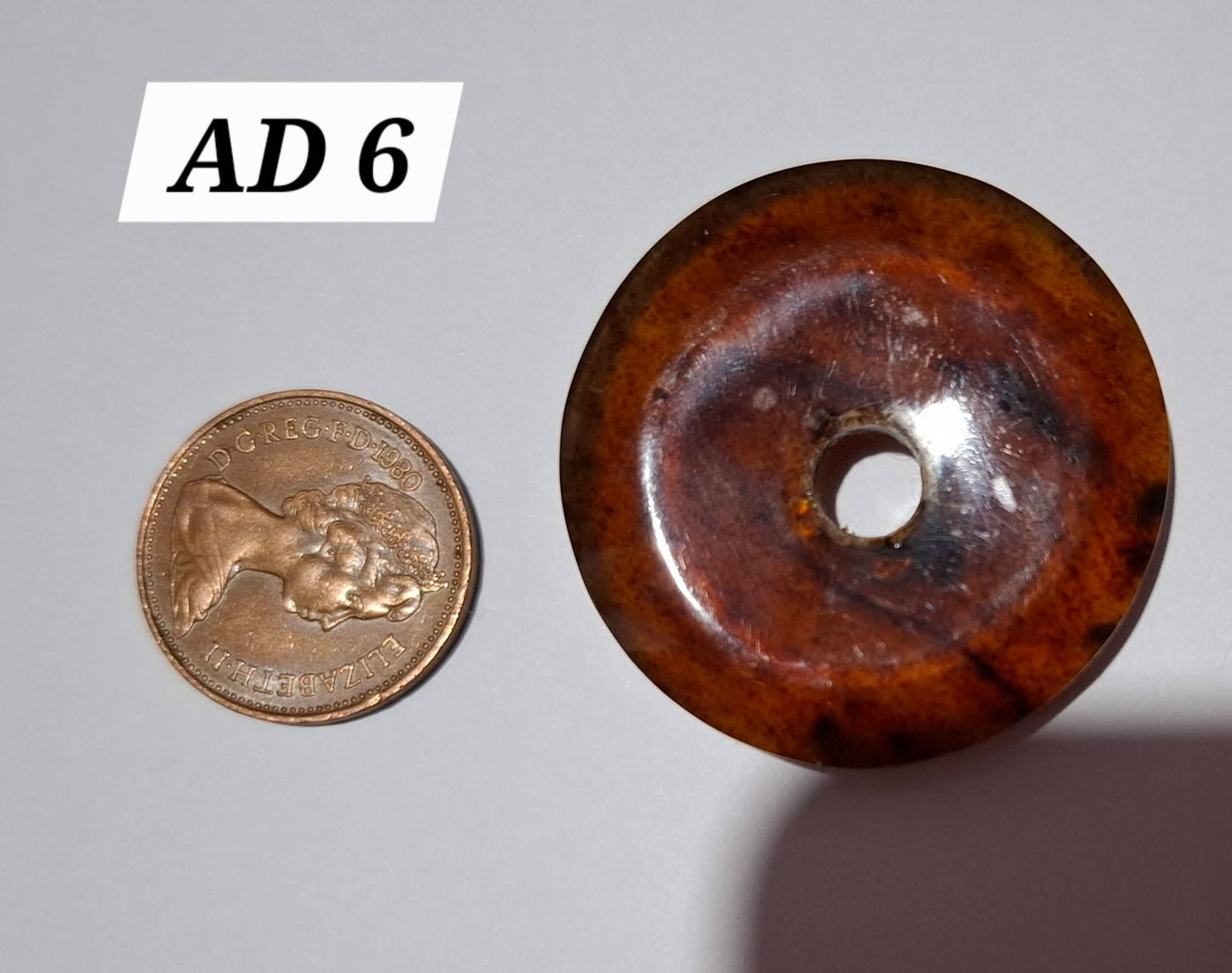 Red Amber Disc / Doughnut carving, sphere holder, 6.13g, Fossil (Ref: AD6)