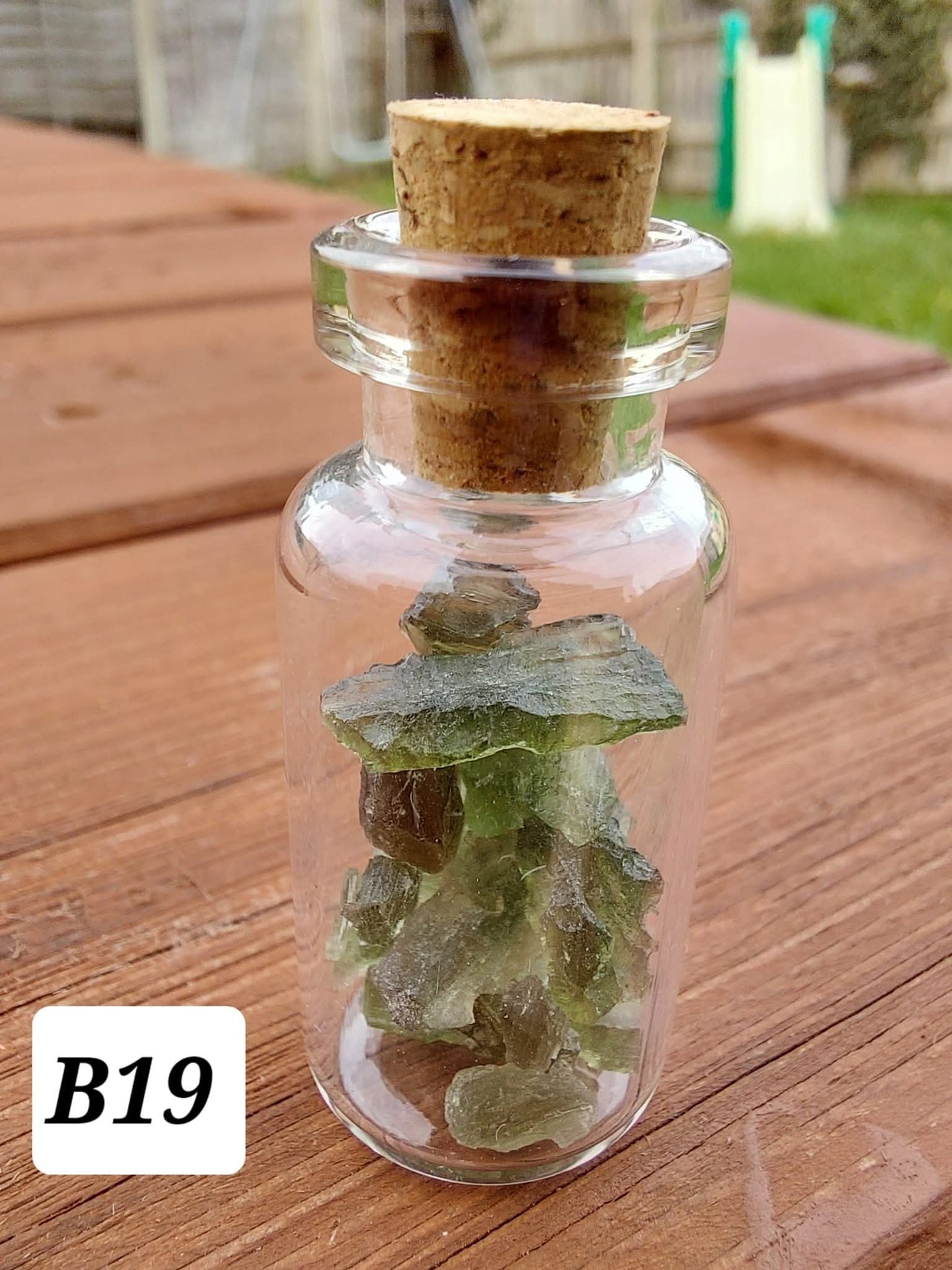 Moldavite chips (2.50g) in 3ml glass Bottle, Tektite (Ref: B19)