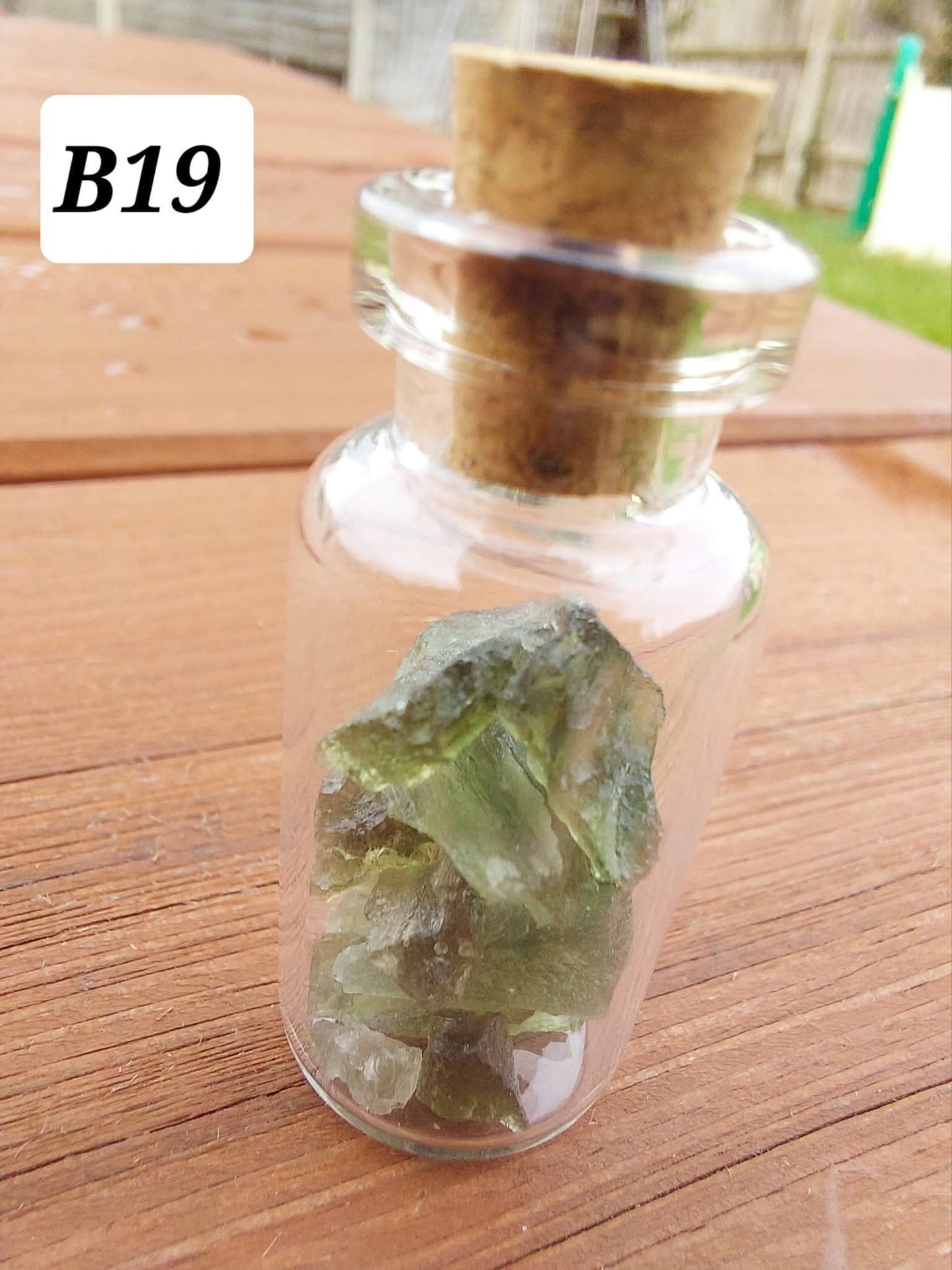 Moldavite chips (2.50g) in 3ml glass Bottle, Tektite (Ref: B19)