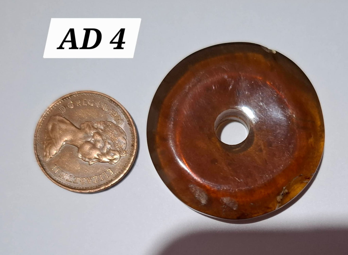 Red Amber Disc/Doughnut carving, sphere holder, 5.39g, Fossil (Ref: AD4)